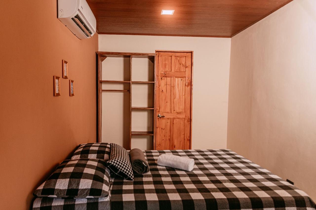 Bedroom with open closet storage in Chachagua, Costa Rica