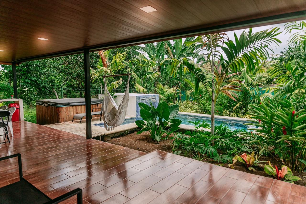 Covered terrace with pool, hammock, and jacuzzi at home in Chachagua, Costa Rica