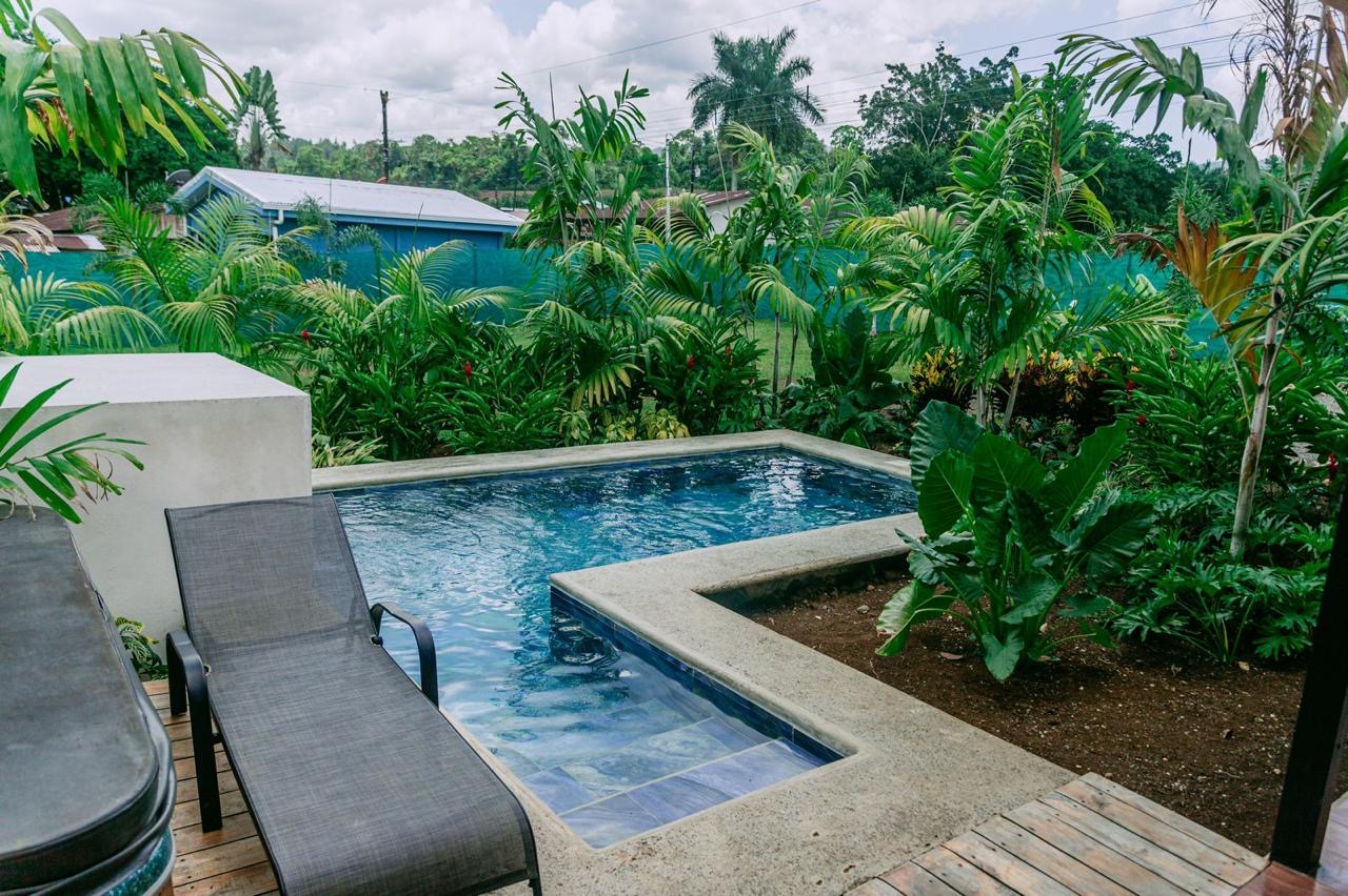 Private swimming pool surrounded by tropical garden in Chachagua, Costa Rica