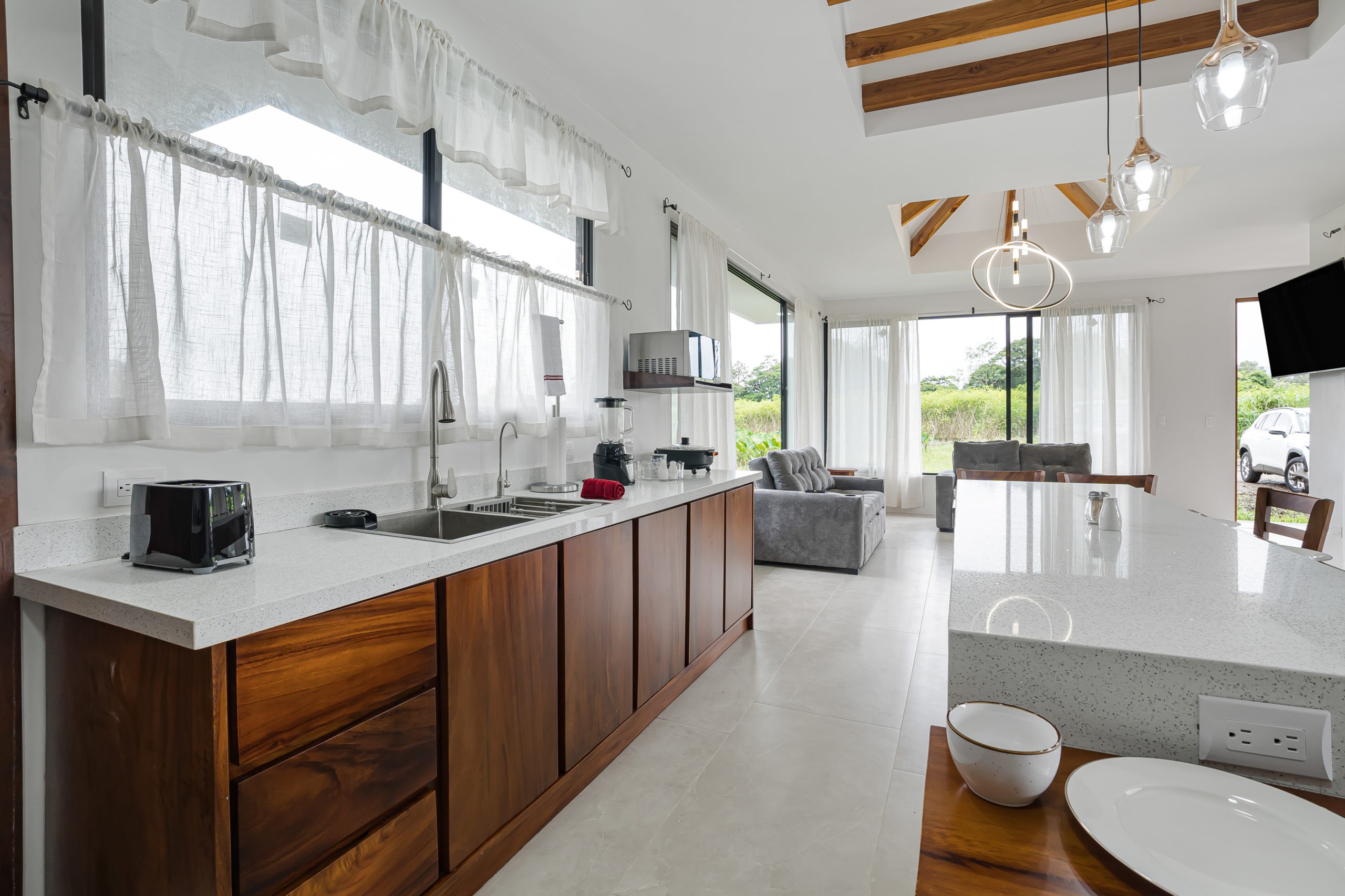 Kitchen counter and open living area at home in La Fortuna, Costa Rica