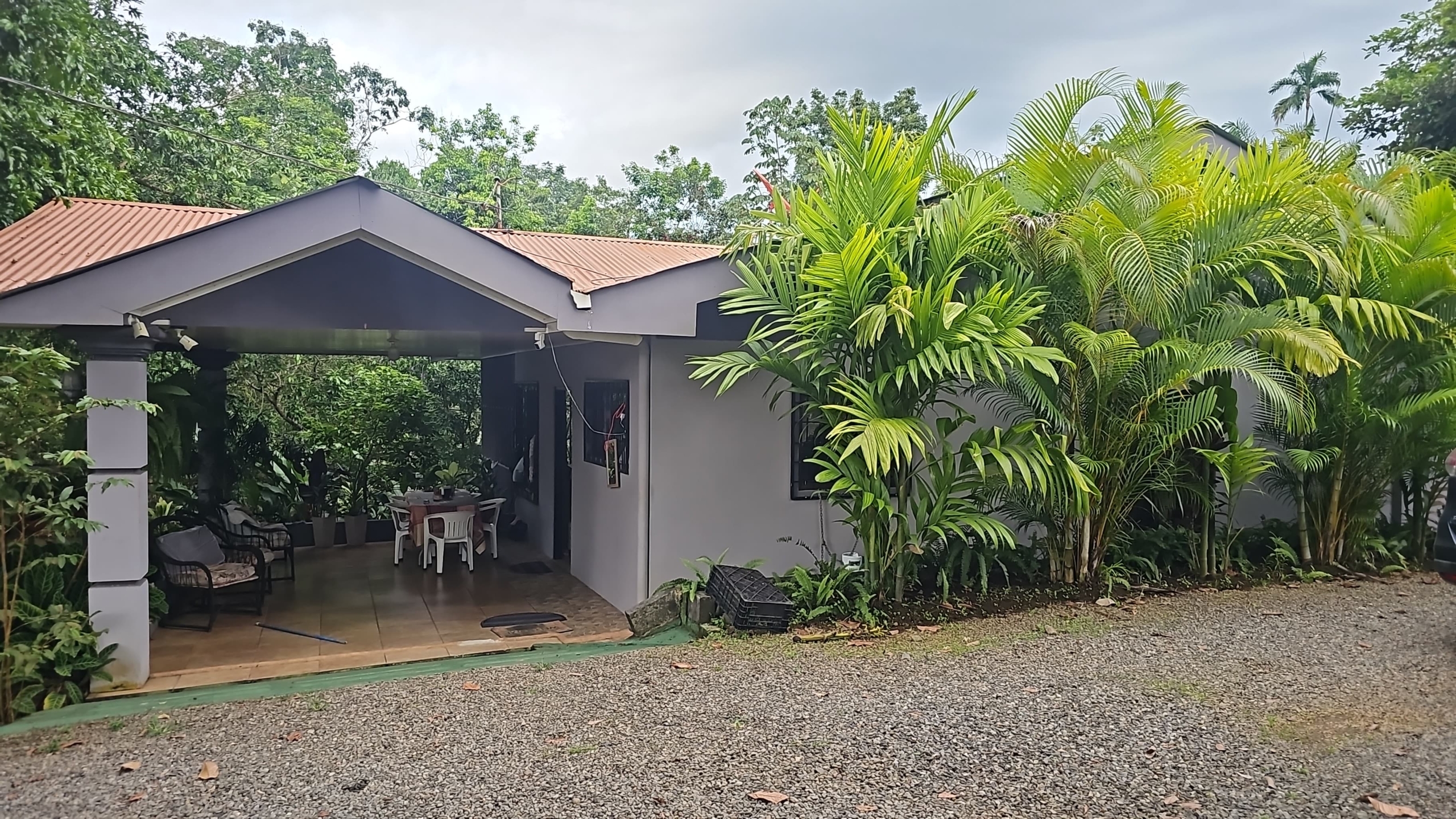 Home with covered terrace and outdoor dining area at the multi-home property near La Fortuna, Costa Rica